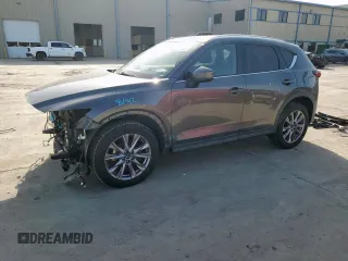 2019 Mazda CX-5 Grand Touring with VIN JM3KFADM8K1634011, listed as a Copart auction lot 57343455 with 67,138 mi miles and Salvage title. Bid and sale history available at DreamBid. Image 1.