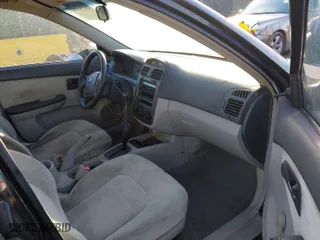 2004 Kia Spectra LX with VIN KNAFE122745033048, listed as a IAAI auction lot 41234181 with 157,410 mi miles. Bid and sale history available at carsss.com. Image 5.