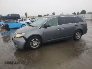 2011 Honda Odyssey EX-L with VIN 5FNRL5H64BB050425, listed as a Copart auction lot 49101795 with 192,238 mi miles and Salvage Title. Bid and sale history available at carsss.com. Image 1.