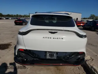 2021 Aston Martin DBX z VIN SCFVUJAW8MTV02134, wystawiony jako Copart lot #72456004 z przebiegiem Nie podano mil oraz Szkody całkowita. Historia ofert i sprzedaży dostępna na DreamBid. Obrazek 6.