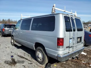 2005 Ford Econoline Passenger XL with VIN 1FBNE31LX5HA76002, listed as a Copart auction lot 43599865 with 198,749 mi miles and Salvage Title. Bid and sale history available at carsss.com. Image 2.