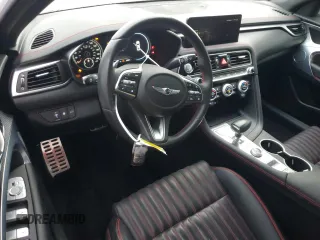 2023 Genesis G70 2.0T with VIN KMTG34TA4PU104576, listed as a Copart auction lot 85082044 with 28,821 mi miles and Salvage Title. Bid and sale history available at DreamBid. Image 8.