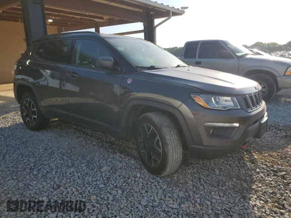 2019 Jeep Compass Trailhawk with VIN 3C4NJDDB5KT722026, listed as a Copart auction lot 52824885 with 105,727 mi miles and Salvage title. Bid and sale history available at DreamBid. Image 4.