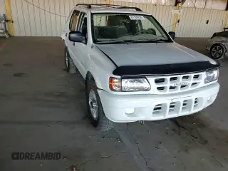 2000 Isuzu Rodeo S z VIN 4S2CK58W3Y4323965, wystawiony jako Copart lot #61189435 z przebiegiem 211 726 mil mil oraz Szkoda całkowita • Salvage title. Historia ofert i sprzedaży dostępna na DreamBid. Obrazek 13.