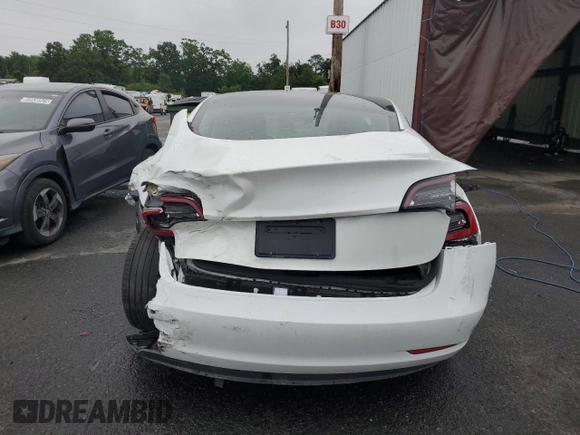 2023 Tesla Model 3 with VIN 5YJ3E1EA0PF463239, listed as a Copart auction lot 59770525 with 48,086 mi miles and Clean title. Bid and sale history available at DreamBid. Image 6.