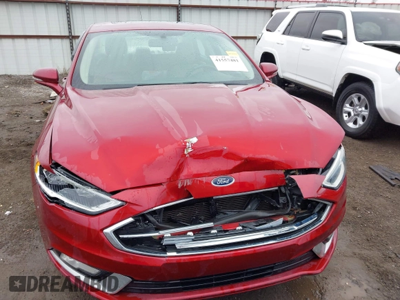 2017 Ford Fusion SE z VIN 3FA6P0H98HR175087, wystawiony jako IAAI lot #41557481 z przebiegiem 103 752 mil mil oraz . Historia ofert i sprzedaży dostępna na DreamBid. Obrazek 12.
