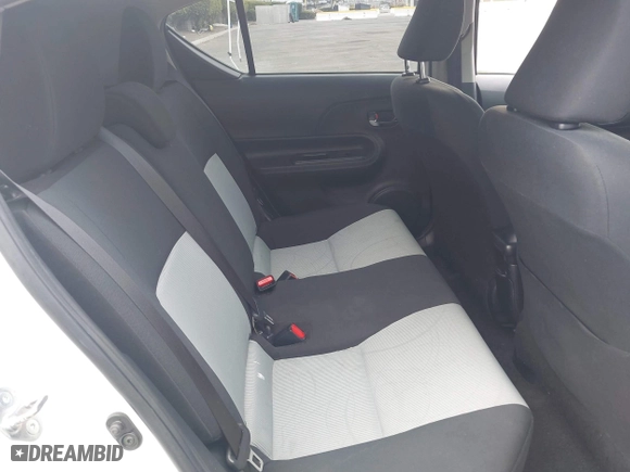 2015 Toyota Prius c One with VIN JTDKDTB3XF1097538, listed as a IAAI auction lot 42031057 with 100,847 mi miles. Bid and sale history available at carsss.com. Image 8.