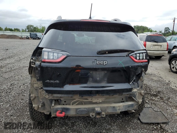 2019 Jeep Cherokee Trailhawk with VIN 1C4PJMBX4KD121641, listed as a Copart auction lot 57128905 with 129,206 mi miles and Salvage title. Bid and sale history available at DreamBid. Image 6.