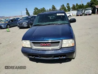 2001 GMC Jimmy SLE Rental Fleet z VIN 1GKDT13W212108144, wystawiony jako Copart lot #58753865 z przebiegiem 254 402 mil mil oraz Szkoda całkowita • Salvage title. Historia ofert i sprzedaży dostępna na DreamBid. Obrazek 14.