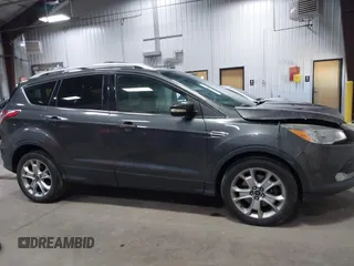 2016 Ford Escape Titanium with VIN 1FMCU9J90GUB35593, listed as a IAAI auction lot 42309020 with 173,019 mi miles and . Bid and sale history available at DreamBid. Image 13.