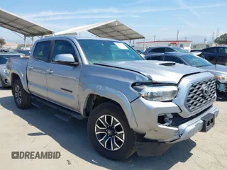 2021 Toyota Tacoma 4WD SR with VIN 3TMCZ5AN6MM393306, listed as a IAAI auction lot 42094095 with 57,217 mi miles. Bid and sale history available at carsss.com. Image 1.