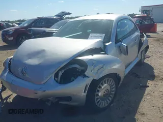2014 Volkswagen Beetle 2.5L w/Sun with VIN 3VWJP7AT7EM633386, listed as a IAAI auction lot 42060290 with 273,374 mi miles and . Bid and sale history available at DreamBid. Image 6.