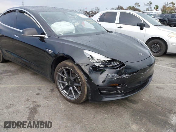 2019 Tesla Model 3 Mid Range with VIN 5YJ3E1EA6KF361808, listed as a IAAI auction lot 41767241 with 96,200 mi miles and . Bid and sale history available at carsss.com. Image 6.