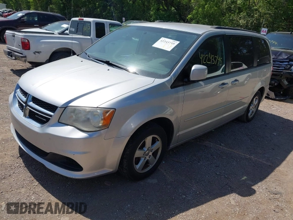 2012 Dodge Grand Caravan SXT with VIN 2C4RDGCG8CR139963, listed as a IAAI auction lot 42243745 with 185,730 mi miles and . Bid and sale history available at DreamBid. Image 2.