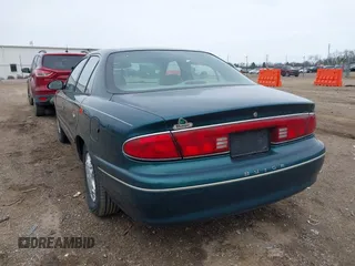 1998 Buick Century Limited with VIN 2G4WY52MXW1573044, listed as a IAAI auction lot 41967391 with 142,169 mi miles. Bid and sale history available at carsss.com. Image 3.