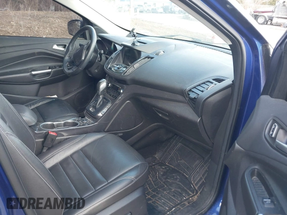 2016 Ford Escape Titanium with VIN 1FMCU9JX5GUA96563, listed as a IAAI auction lot 41695524 with 76,992 mi miles. Bid and sale history available at carsss.com. Image 5.