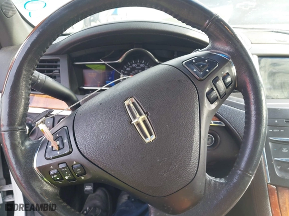 2013 Lincoln MKS with VIN 1LNHL9DK4DG611684, listed as a IAAI auction lot 42043879 with 132,866 mi miles. Bid and sale history available at carsss.com. Image 11.