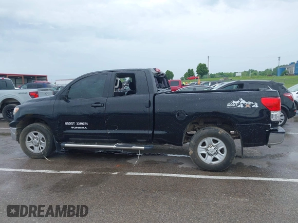 2012 Toyota Tundra z VIN 5TFRM5F15CX040630, wystawiony jako IAAI lot #42213728 z przebiegiem 242 469 mil mil oraz . Historia ofert i sprzedaży dostępna na DreamBid. Obrazek 13.