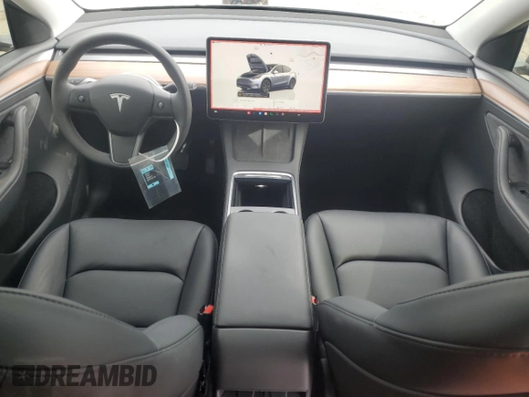 2025 Tesla Model Y Long Range with VIN 7SAYGDED7SF227582, listed as a Copart auction lot 47556595 with 5,340 mi miles and Salvage Title. Bid and sale history available at DreamBid. Image 8.