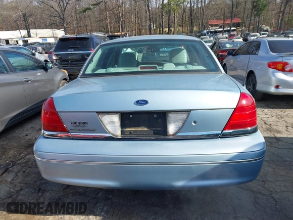 2005 Ford Crown Victoria LX z VIN 2FAFP74W65X135964, wystawiony jako IAAI lot #41271175 z przebiegiem 82 494 mil mil oraz . Historia ofert i sprzedaży dostępna na DreamBid. Obrazek 16.