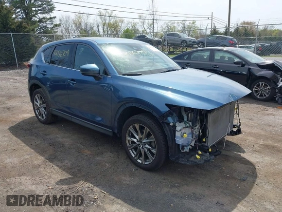 2019 Mazda CX-5 Signature with VIN JM3KFBEY1K0512880, listed as a IAAI auction lot 42036904 with 92,650 mi miles. Bid and sale history available at carsss.com. Image 1.