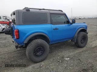 2023 Ford Bronco with VIN 1FMDE5AHXPLB26651, listed as a Copart auction lot 77497964 with 19,700 mi miles and Salvage Title. Bid and sale history available at carsss.com. Image 3.