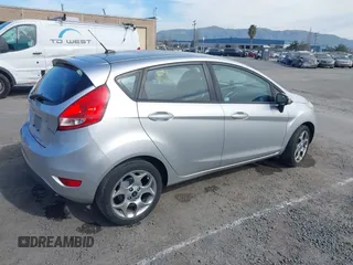 2011 Ford Fiesta SES with VIN 3FADP4FJ1BM102434, listed as a IAAI auction lot 41703287 with 124,476 mi miles. Bid and sale history available at carsss.com. Image 4.