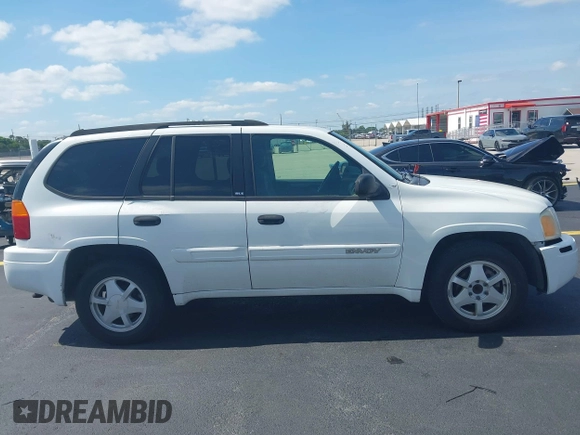 2003 GMC Envoy SLT z VIN 1GKDS13S532221928, wystawiony jako IAAI lot #42211340 z przebiegiem 149 902 mil mil oraz . Historia ofert i sprzedaży dostępna na DreamBid. Obrazek 13.