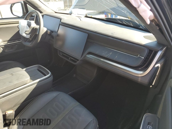 2025 Rivian R1S Adventure z VIN 7PDSGBBA5SN048839, wystawiony jako Copart lot #89199375 z przebiegiem 5177 mil mil oraz Szkody całkowita. Historia ofert i sprzedaży dostępna na DreamBid. Obrazek 8.