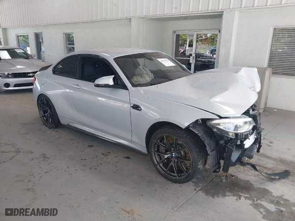 2020 BMW M2 Competition with VIN WBS2U7C01L7F87723, listed as a IAAI auction lot 40319156 with 55,309 mi miles. Bid and sale history available at carsss.com. Image 1.