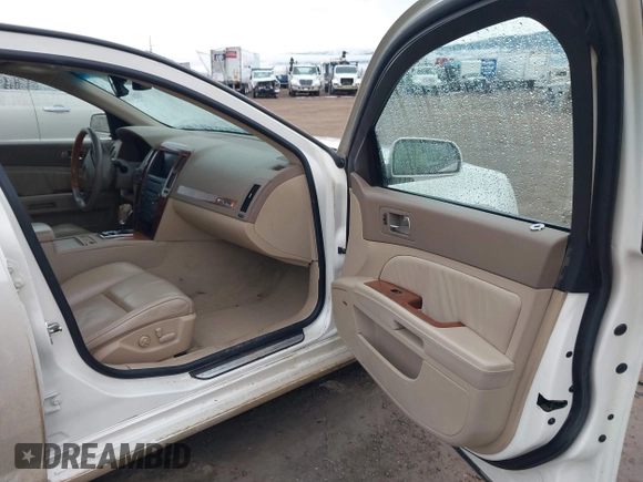 2005 Cadillac STS z VIN 1G6DC67A250231552, wystawiony jako IAAI lot #41765312 z przebiegiem 201 611 mil mil oraz . Historia ofert i sprzedaży dostępna na DreamBid. Obrazek 5.