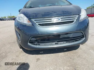 2011 Ford Fiesta SE z VIN 3FADP4BJ5BM219052, wystawiony jako IAAI lot #42297403 z przebiegiem 108 302 mil mil oraz . Historia ofert i sprzedaży dostępna na DreamBid. Obrazek 6.