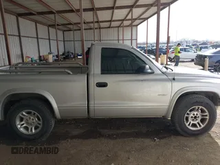 2002 Dodge Dakota z VIN 1B7FL36X42S532446, wystawiony jako IAAI lot #41683398 z przebiegiem 245 626 mil mil oraz . Historia ofert i sprzedaży dostępna na DreamBid. Obrazek 13.