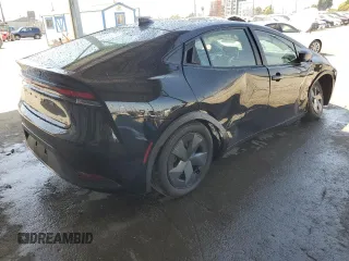2024 Toyota Prius LE z VIN JTDACAAU0R3017895, wystawiony jako Copart lot #51476875 z przebiegiem 25 826 mil mil oraz Szkoda całkowita • Salvage title. Historia ofert i sprzedaży dostępna na DreamBid. Obrazek 3.