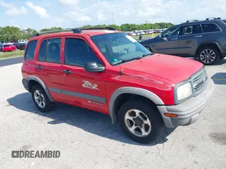 2003 Chevrolet Tracker ZR2 z VIN 2CNBJ734736914220, wystawiony jako IAAI lot #42351611 z przebiegiem 190 578 mil mil oraz . Historia ofert i sprzedaży dostępna na DreamBid. Obrazek 1.