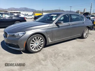 2018 BMW 7 Series 740e xDrive with VIN WBA7J2C55JG938385, listed as a Copart auction lot 49109985 with 81,567 mi miles and Salvage Title. Bid and sale history available at DreamBid. Image 1.