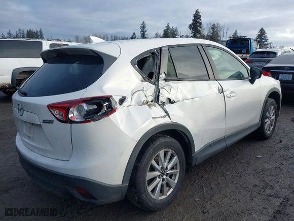 2016 Mazda CX-5 Touring with VIN JM3KE2CY1G0701106, listed as a IAAI auction lot 41514966 with NaN miles. Bid and sale history available at carsss.com. Image 4.
