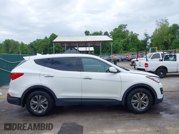 2014 Hyundai Santa Fe z VIN 5XYZTDLB5EG147354, wystawiony jako IAAI lot #42235940 z przebiegiem 107 466 mil mil oraz . Historia ofert i sprzedaży dostępna na DreamBid. Obrazek 13.