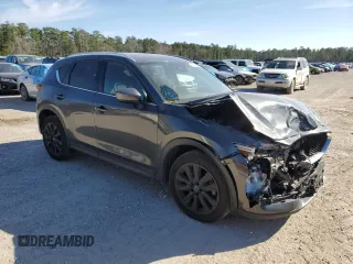 2021 Mazda CX-5 Signature with VIN JM3KFBEY2M0437304, listed as a Copart auction lot 88841415 with 57,100 mi miles and Salvage Title. Bid and sale history available at carsss.com. Image 4.