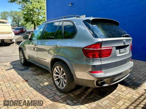 2012 BMW X5 35i with VIN 5UXZV4C55CL986439, listed as a Copart auction lot 63034725 with 188,238 mi miles and Clean title. Bid and sale history available at DreamBid. Image 4.