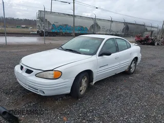 1999 Pontiac Grand Am SE1 with VIN 1G2NE52EXXM781713, listed as a IAAI auction lot 41914492 with 148,435 mi miles. Bid and sale history available at carsss.com. Image 2.