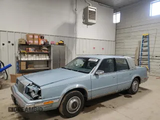 1989 Chrysler New Yorker z VIN 1C3BC663XKD578434, wystawiony jako Copart lot #84945044 z przebiegiem 51 067 mil mil oraz Szkody całkowita. Historia ofert i sprzedaży dostępna na DreamBid. Obrazek 1.