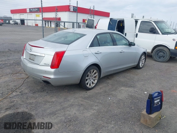 2014 Cadillac CTS Luxury AWD z VIN 1G6AX5SX2E0196881, wystawiony jako IAAI lot #41707633 z przebiegiem 169 168 mil mil oraz . Historia ofert i sprzedaży dostępna na DreamBid. Obrazek 4.