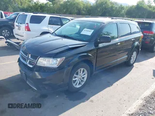 2013 Dodge Journey SXT with VIN 3C4PDDBG1DT606887, listed as a IAAI auction lot 42440507 with 250,836 mi miles and . Bid and sale history available at DreamBid. Image 2.