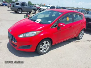 2015 Ford Fiesta SE z VIN 3FADP4EJ4FM166653, wystawiony jako IAAI lot #42410322 z przebiegiem 141 305 mil mil oraz . Historia ofert i sprzedaży dostępna na DreamBid. Obrazek 2.