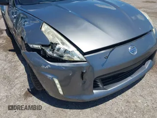 2013 Nissan 370Z Touring z VIN JN1AZ4EH2DM384011, wystawiony jako IAAI lot #42274166 z przebiegiem 87 499 mil mil oraz . Historia ofert i sprzedaży dostępna na DreamBid. Obrazek 6.
