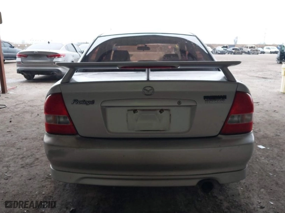 2003 Mazda Protege DX with VIN JM1BJ225030124381, listed as a IAAI auction lot 41607937 with 141,484 mi miles. Bid and sale history available at carsss.com. Image 16.