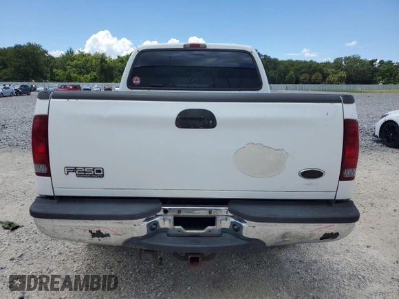 2003 Ford F-250 XL with VIN 1FTNX20L63EB37975, listed as a Copart auction lot 65723935 with 157,377 mi miles and Salvage title. Bid and sale history available at DreamBid. Image 6.