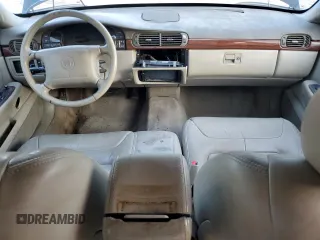 1999 Cadillac DeVille z VIN 1G6KD54Y5XU767438, wystawiony jako Copart lot #86133764 z przebiegiem Nie podano mil oraz Nie do naprawy • Non repairable. Historia ofert i sprzedaży dostępna na DreamBid. Obrazek 8.