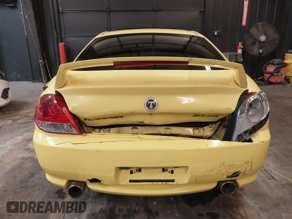 2006 Hyundai Tiburon GT z VIN KMHHN65F56U225936, wystawiony jako IAAI lot #41695280 z przebiegiem 121 110 mil mil oraz . Historia ofert i sprzedaży dostępna na DreamBid. Obrazek 16.